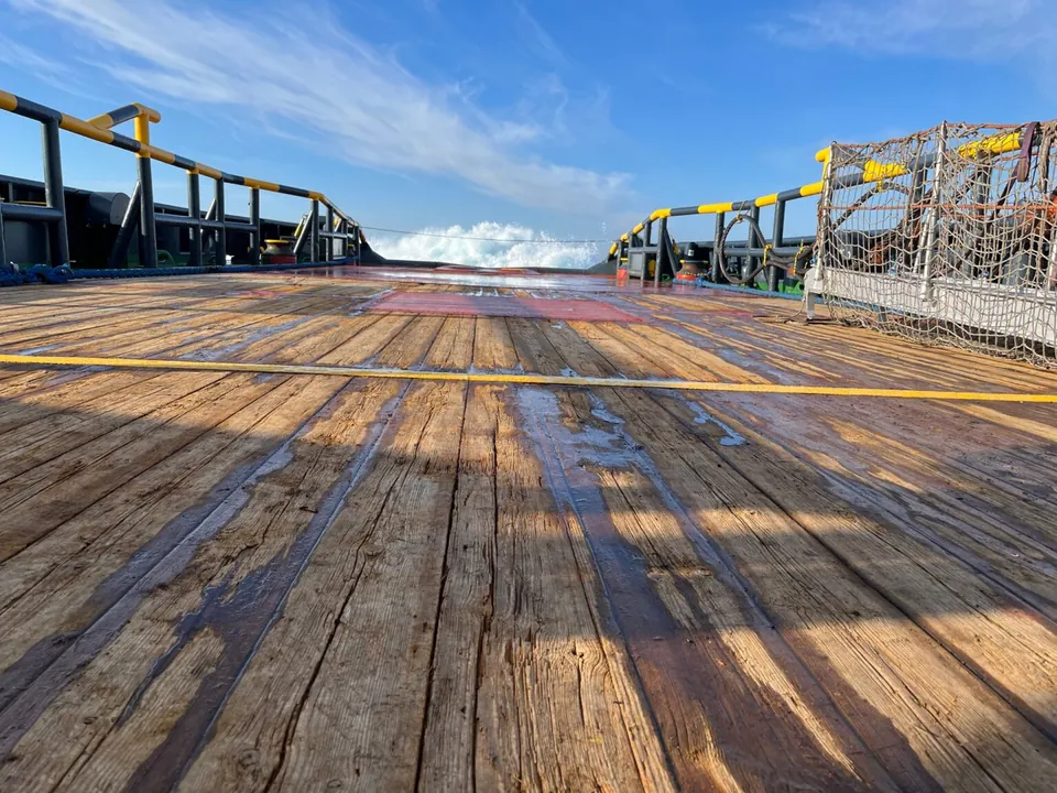 Wooden tug deck on open water
