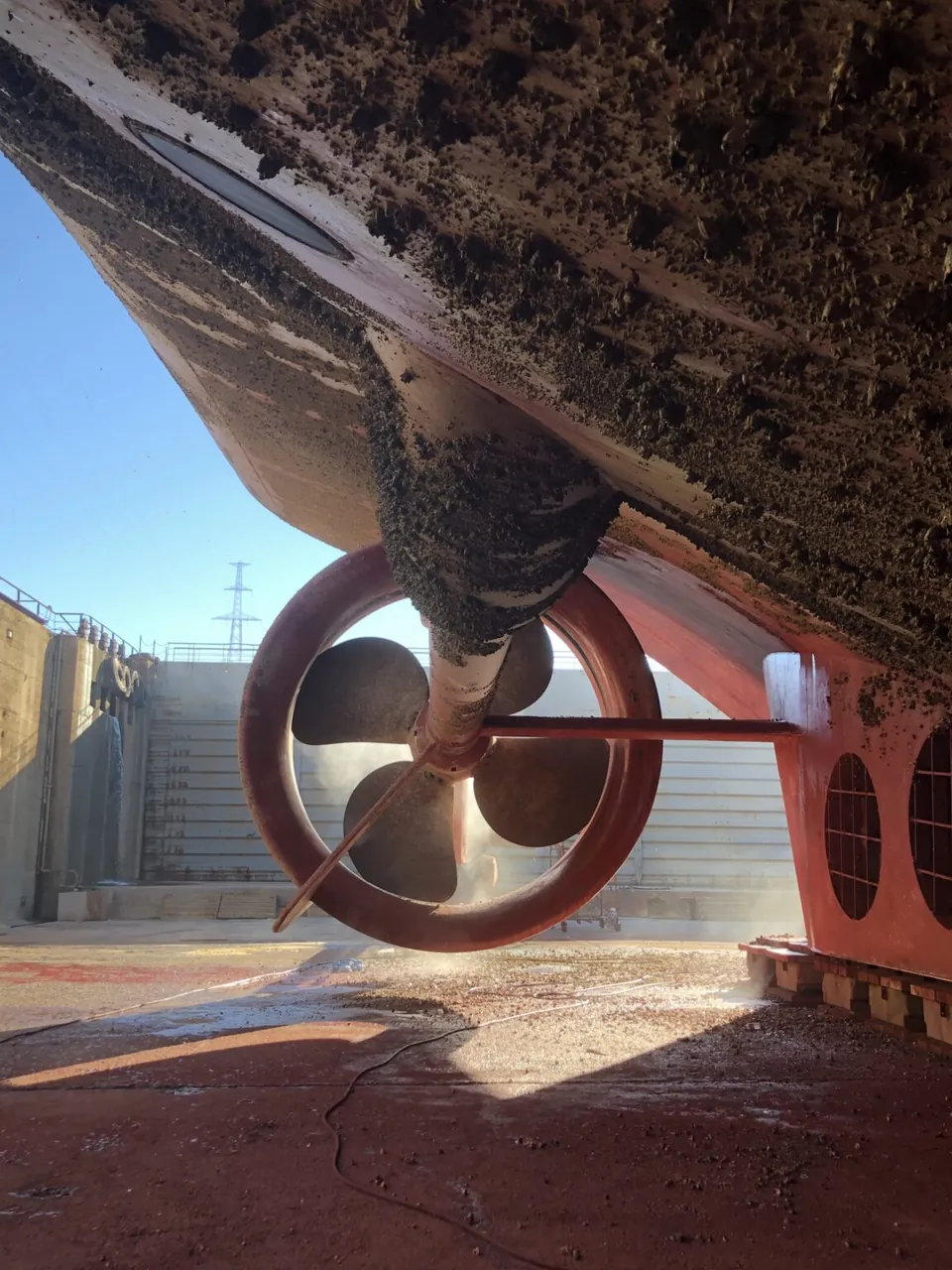 Ship hull and propeller in a dry dock
